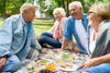 group of seniors enjoying a picnic together.